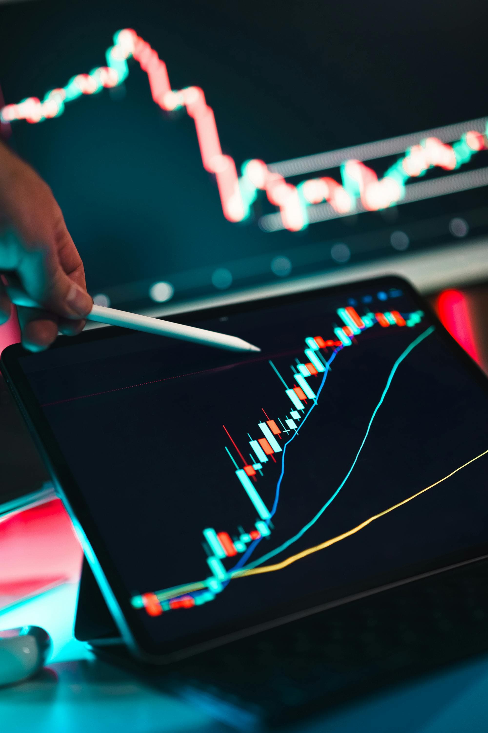 Trader reviewing live market charts on a tablet