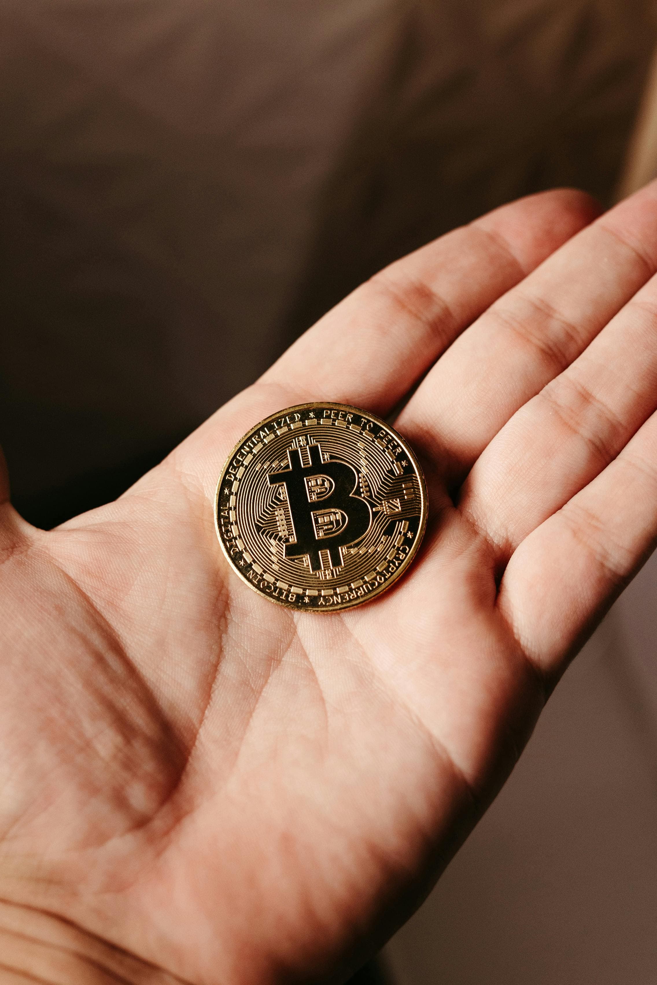Bitcoin held in a hand